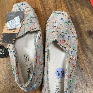 Brand new with tags still attached, TOMS Christmas glow in the dark